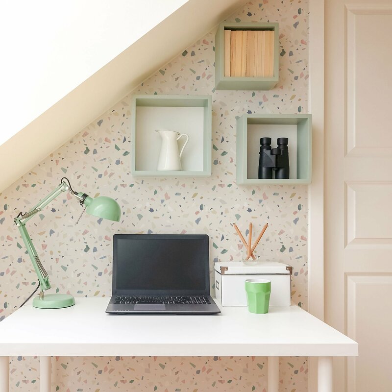 terrazzo wallpaper acts as accent wall in home office